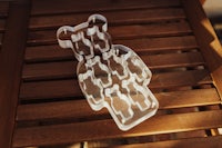 a bear shaped cookie cutter on a wooden table