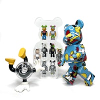 a collection of benjamin bearbrick figurines in a clear box