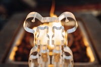 a metal sculpture sitting on top of a fire pit