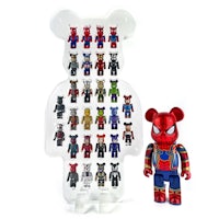 a spider - man and a spider - man teddy bear stand next to each other